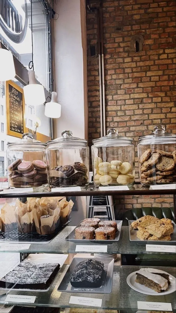 Bakery display case stocked with cookies, cakes and pastries
