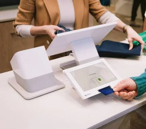 Shopper paying by chip card on a Clover Station Duo customer display